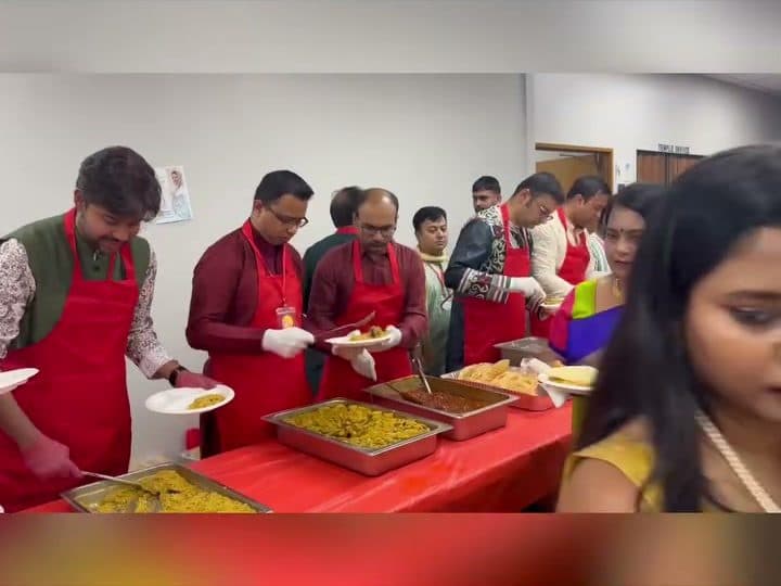 Volunteers serving bhog at Durga Puja 2025